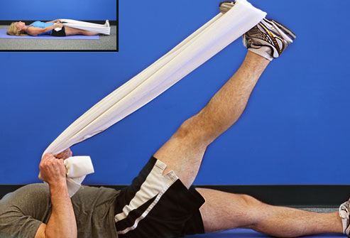 Trainer doing hamstring stretch